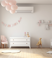 A baby room in pink with an air conditioning unit on the wall