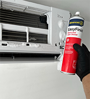 Cleaning Product in front of Split Airconditioning Unit